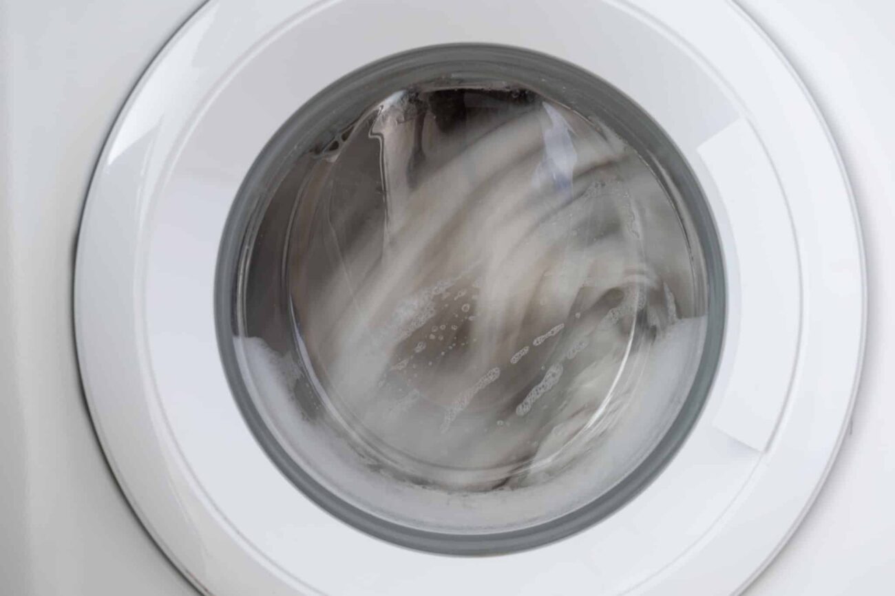 2 Clothes spinning in a washing machine drum during the high speed spin cycle
